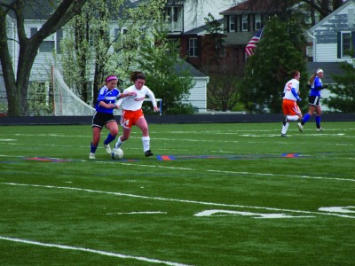 Senior Alison Bayly fights for the ball against Westminster. The Hounds defeated Westminster 2-1. (Claire Bliss) 