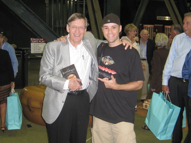 Hample with baseball commisioner Bud Selig. Selig is holding Hample's third book. Photo from Zack Hample. 