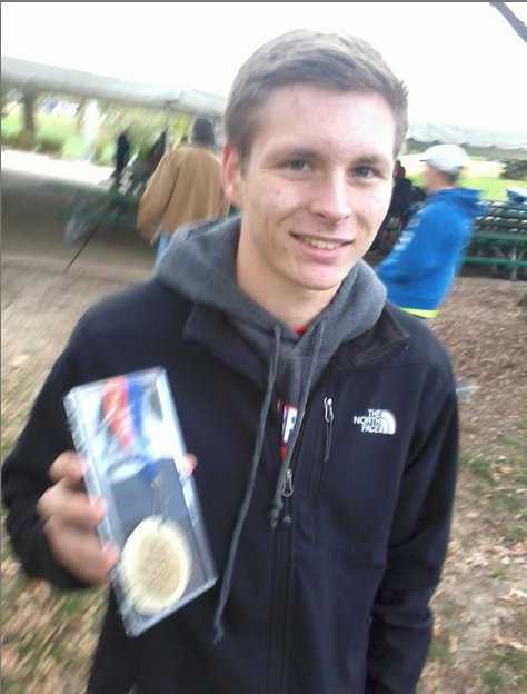 Matthew Garrett smiles with his ninth place medal. (Peter Baugh)