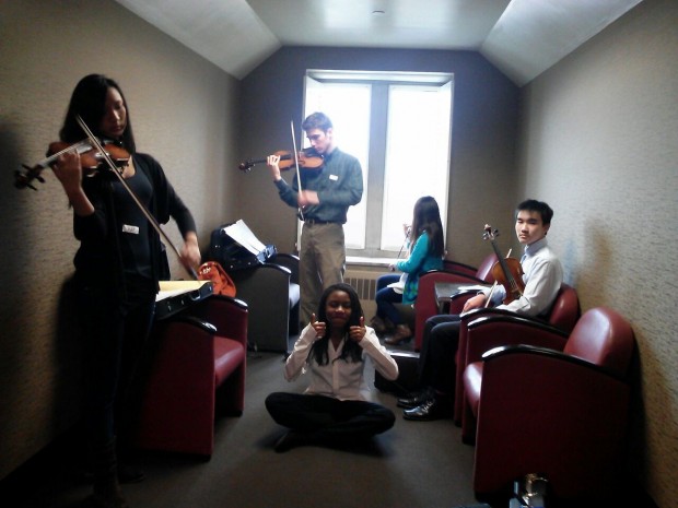 From left to right: Victoria Yi, Sam Rubin, Chi-Chi Onwumere, Ine Suh, and Raymond Li warm up in preparation for their All-State Orchestra auditions.