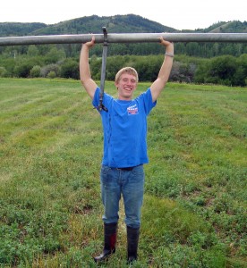 Sophomore JOnathon Shumway worked hard on an Idaho ranch over the summer, including laying irrigation pipe. (Photo courtesy of Jonathon Shumway)