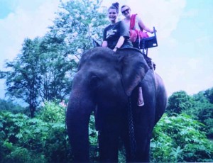 Junior Allison Goldfarb rides an elephant during her recent trip to Thailand.  During her visit, she explored villages and helped with community service projects.  (Photo courtesy of Allison Goldfarb)