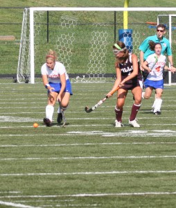 Anna Krane battle for a free ball with a Villa Duchesne defender. Krane is a co-captain of the varsity field hockey team.