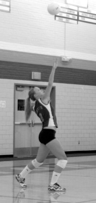 Female Athlete of the Month Senior Maggie Lanter serves for the Hounds in a recent match.