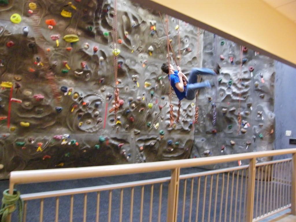 Junior Henry Myers demonstrates his Tarzan abilities in Basic Climbing. (Madeleine Fleming)