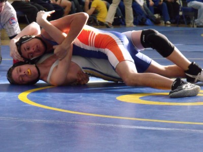 Sophomore Justin Williams gets two points for a take down  in the John Burroughs Tournament on Saturday Dec. 4, 2009. (Thalia Sass)