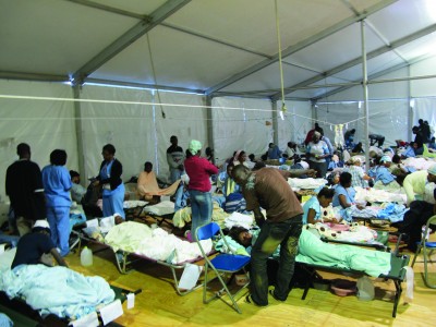 Victims recover and receive treatment in a hospital tent.