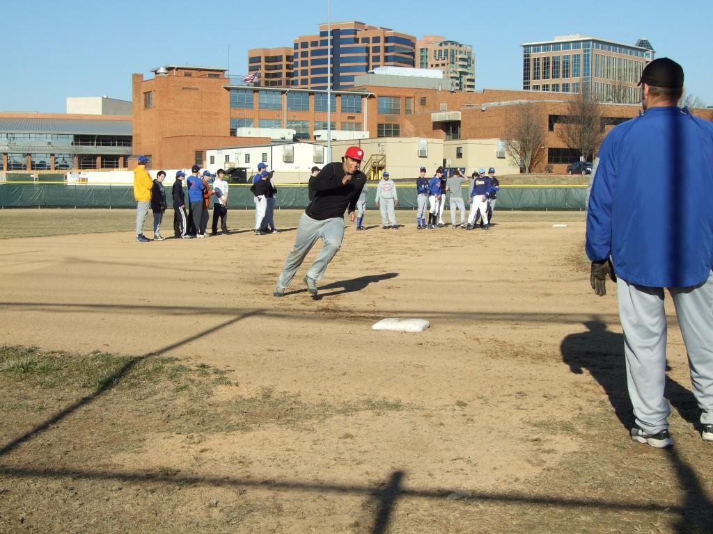Senior Sam Hagene rounds 3rd base during a drill at baseball practice on Friday afternoon. (Elizabeth Sikora)