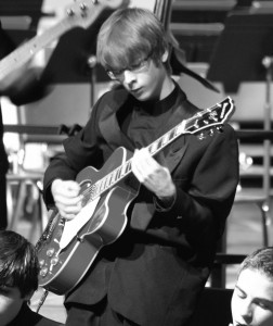 Junior Greg Dallas plays his favorite instrument, the guitar, at a CHS jazz band concert. (Courtesy of Greg Dallas)