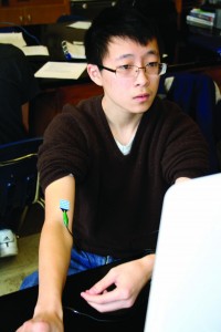 APBio1 Junior Shuyang Li collects data for an AP Biology lab. (Paul Lisker)