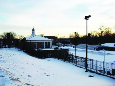 The sun sets on the Shaw Park Aquatic Center, enveloped in snow.  Currently, community members are pushing for the renaming of the Shaw Park Aquatic Center to Wally Lundt Pool in tribute to his life-long service to the Clayton community.  Presently, this push has not found support with the Board of Education. (Jonathan Shumway)