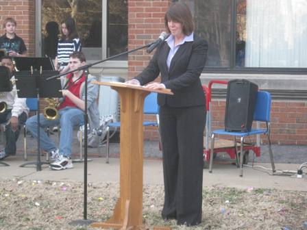 Superintendent Mary Herrmann delivers the welcoming speech at the ceremony.