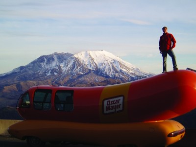 Zach Kirk poses with the Wienermobile on one of his many cross-country adventures working for Oscar Mayer.