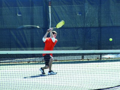 Junior Dylan Schultz delivers a strong backhanded blow during a recent match (Madeline Fleming)