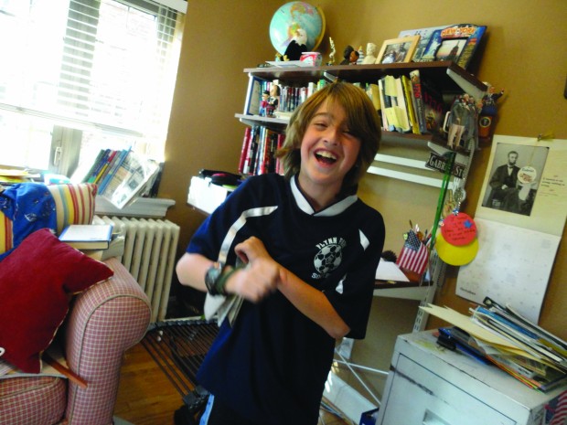 10-year-old Gabe Fleisher in his office.