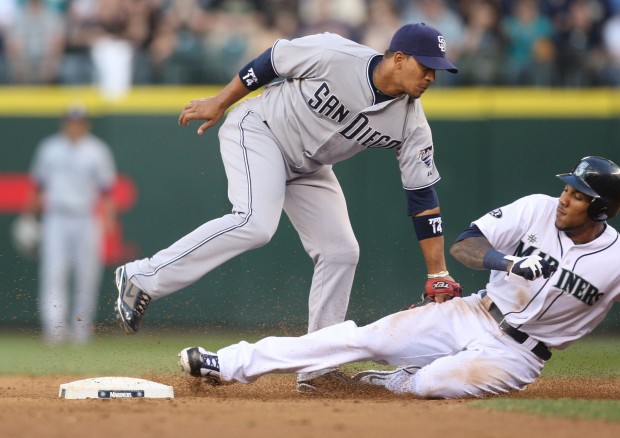 Greg Halman, right, of the Seattle Mariners is caught stealing and tagged out by Alberto Gonzalez (14) of the San Diego Padres in the fifth inning at Safeco Field in Seattle, Washington, on Saturday, July 2, 2011. The Padres defeated the Mariners, 1-0. (Jim Bates/Seattle Times/MCT)
