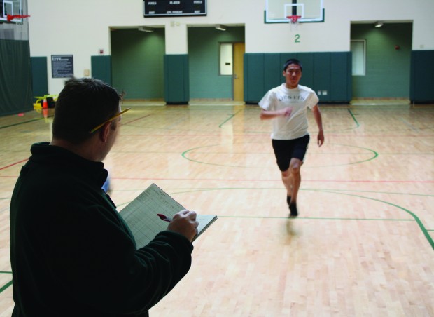 Coach Horrell times a student during the pacer test.