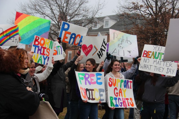 Supporters from outside of CHS display their signs.