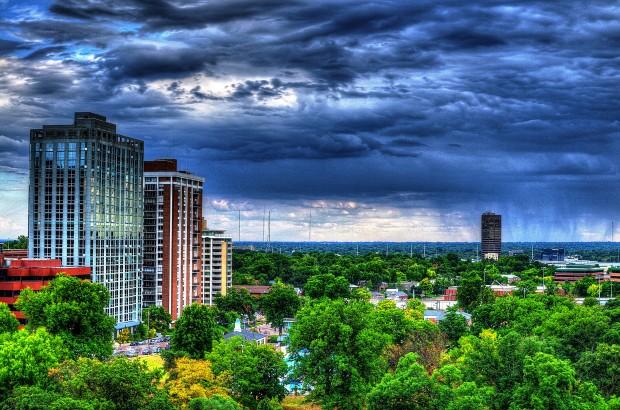 Shaw Park's high-rises and forests caught juxtaposing each other as a storm looms overhead. This is a high dynamic range photo, being an amalgamation of seven different exposed images, effectively bringing out all of the highlights and shadows. Photo by William Wysession.