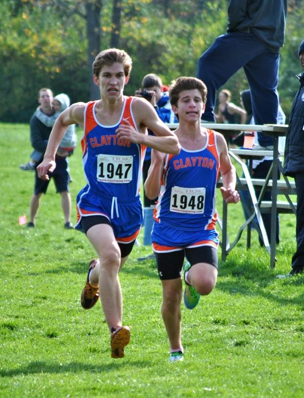 Senior Derrick Stone and Sophomore Ben Tamsky race to the finish of their blazing fast 17:30 5K.