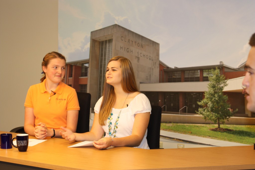 News Anchors Emily Longman and Carly Beard prepare for the taping of the daily announcements. Photo taken by Erin Castellano.