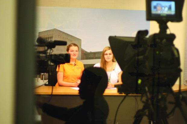 Emily Longman (senior) and Carly Beard (junior) give the morning announcements. Photo by Erin Castellano. 