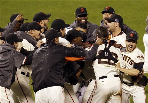 The Giants celebrate after defeating the Cardinals in Game 7 of the NLCS. (AP Photo/Eric Risberg)