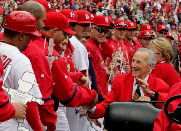 The St. Louis Cardinals line up to congratulate Hall of Famer Stan Musial, right, as he is honored during the middle of the sixth inning against the Colorado Rockies at Busch Stadium in St. Louis, Missouri, on Saturday, October 2, 2010. (Laurie Skrivan/St. Louis Post-Dispatch/MCT)