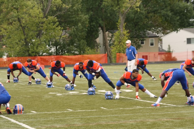 At half time of the homecoming football game players stretch in preparation for the rest of the game. Photo by Dana Schwartz.