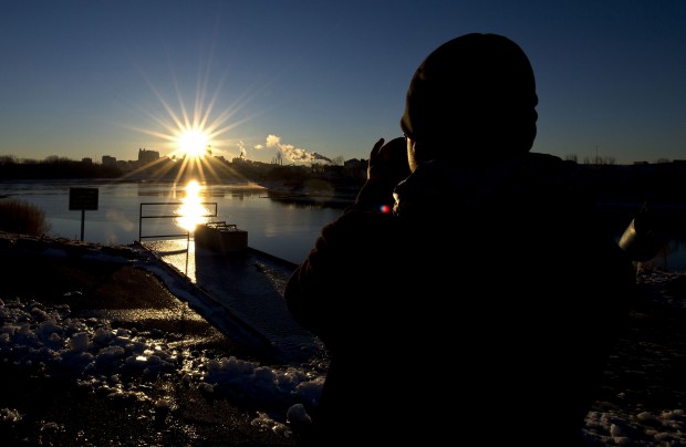 Wayne Yang photographed the sun rising over Kansas City from Kaw Point in Kansas City, Kansas, on the last day of the Mayan Calendar, Friday, December 21, 2012. (John Sleezer/Kansas City Star/MCT)