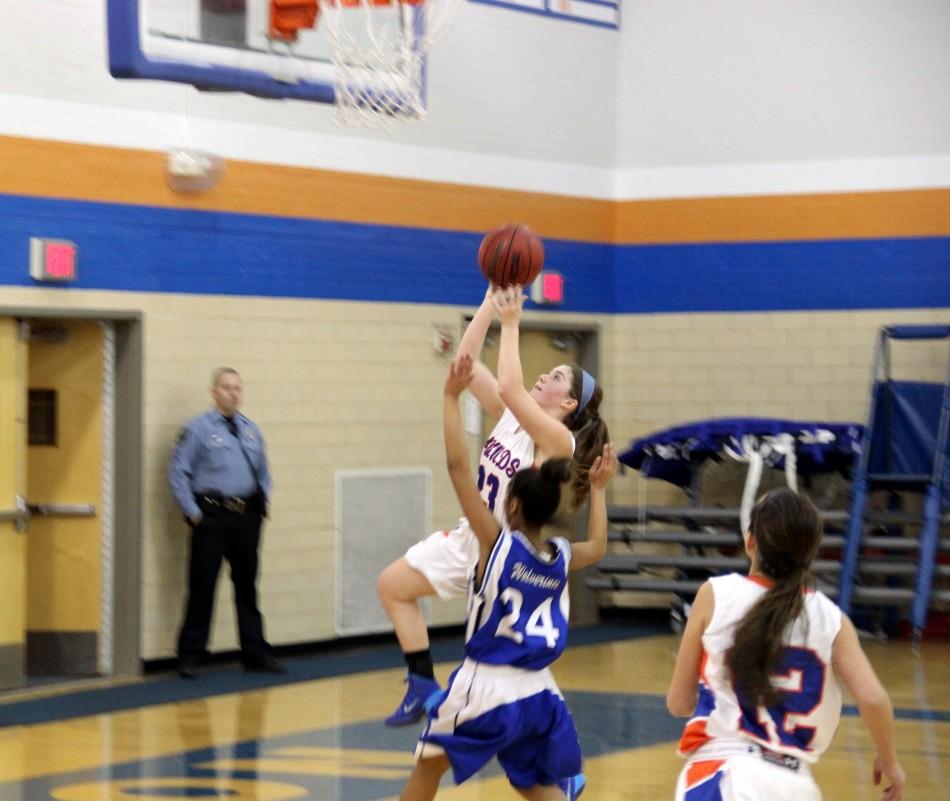 Junior Reeves Oyster makes a lay-up in Tuesdays Varsity Girls basketball game against Vashon High School.  The Lady Hounds led the entire game and finished with a winning score of 71-11.