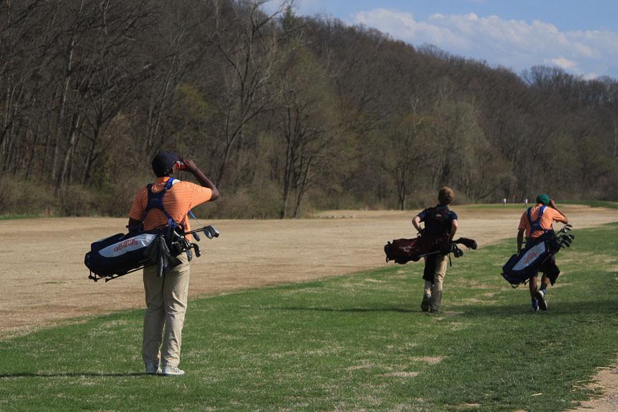 Matthew Helm (11) stops for a drink on the fairway during a JV golf meet against Rockwood Summit. The two teams played at Sugar Creek Golf Course on Thursday with Rockwood managing less strokes and getting the win.