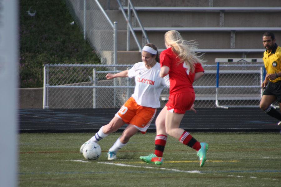 In this photo the CHS girls varsity soccer team takes on Kirkwood. The Lady Hounds played hard last Thursday afternoon but, unfortunately, lost. 