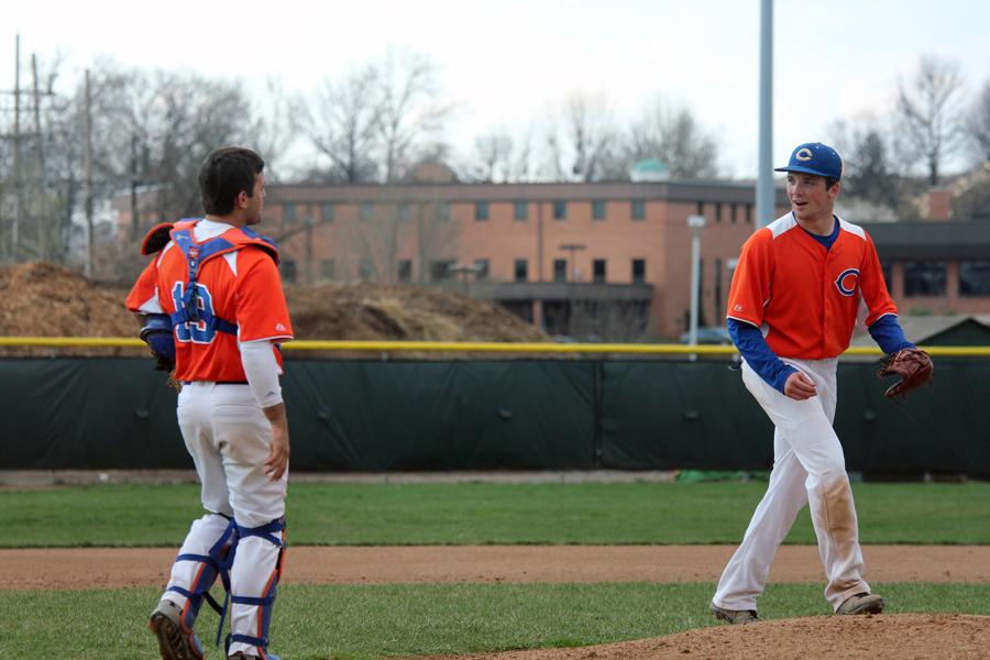 Catcher Jake Brown (11) exchanges words with pitcher John Howard (11) before the start of a new inning. Despite a strong start, Kirkwood pulled ahead toward the end of the game and got the win. Final Clayton 2 Kirkwood 3