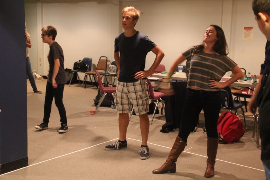 Adam Treutelaar warms up with the cast before beginning rehearsal.  (Leah Shaffer)