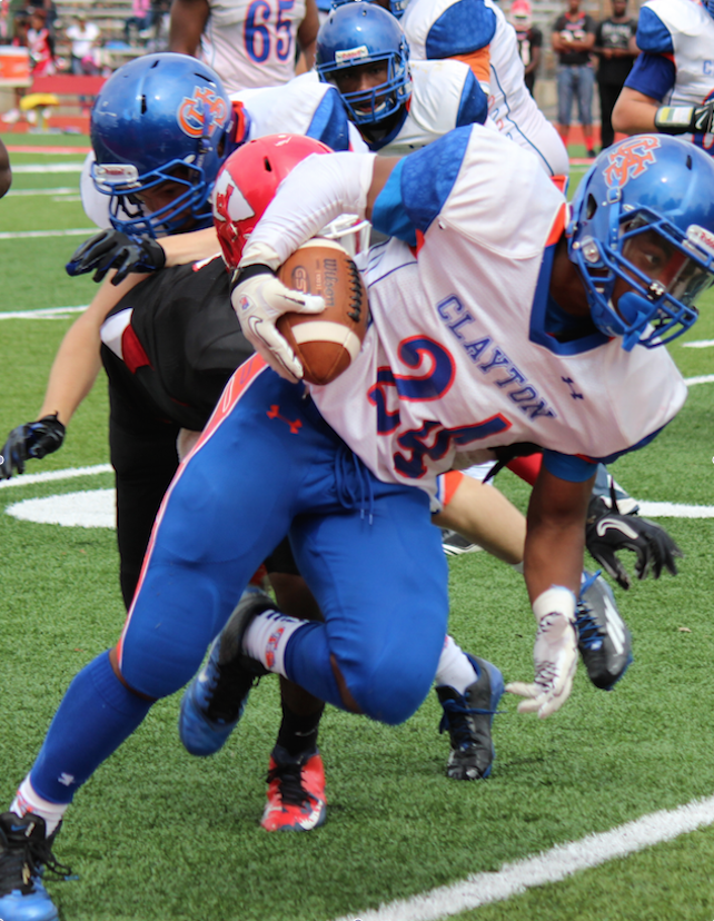 Junior Tyler Melvin dodges many Jennings players during Clayton's game against Jennings at Jennings. Clayton had a close loss 34-21, but the game was very close throughout.