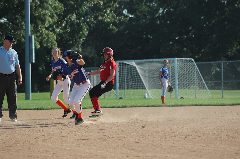 Softmore Anisa Miller going for the ball and scoring the third out. 