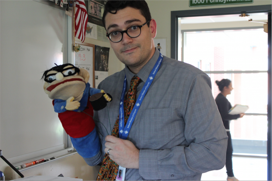 Mr. Glossenger holds the puppet of himself.