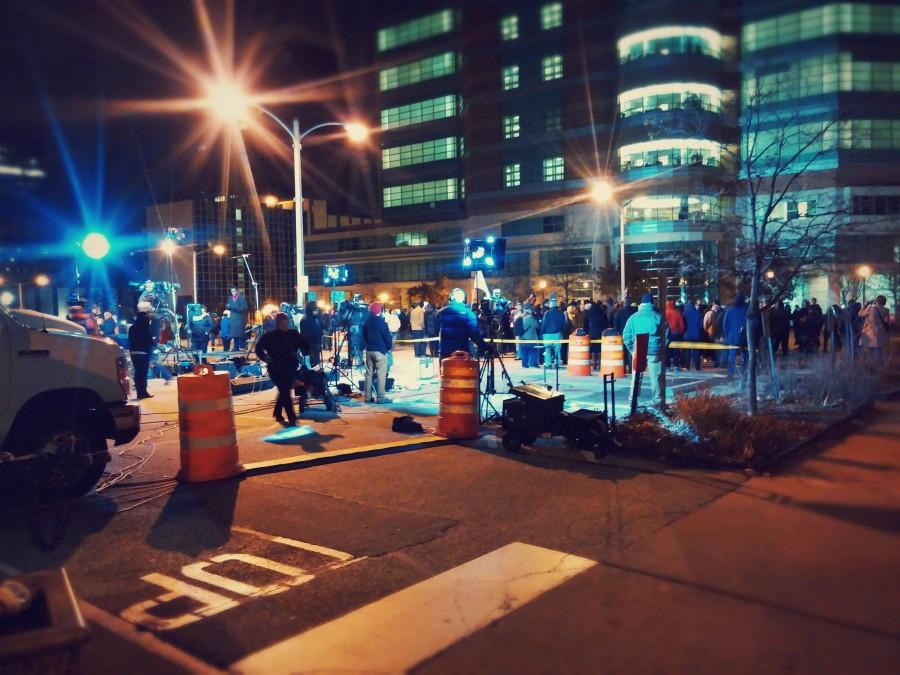 Protesters+and+media+outlets+gather+in+a+parking+lot+in+Downtown+Clayton+for+the+release+of+the+indictment.+