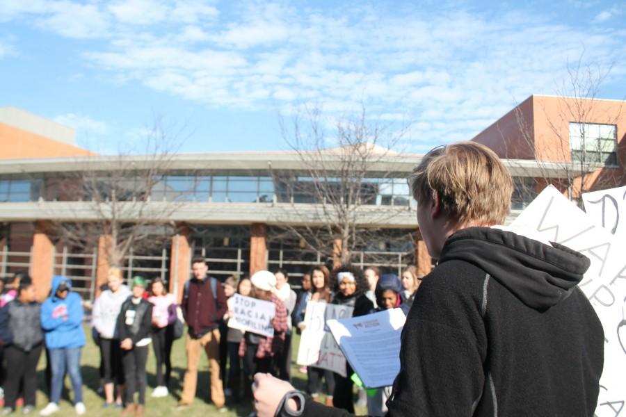 Luke Davis, CHS Junior, speaks to a crowd of protesters in below freezing weather in the Quad.  