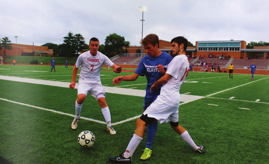 Junior Sam Schneider fights for the ball against Kirkwood. (Photo by Andrew Erblich)