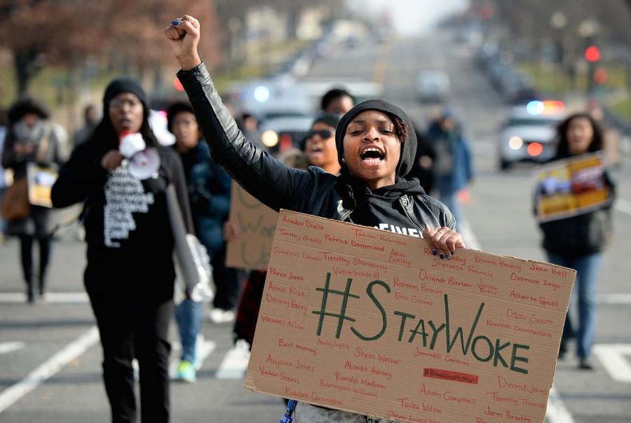 Thousands of Americans rally at a national march against police violence, Dec. 13, 2014 in Washington D.C.The families of Michael Brown, Eric Garner, and Akai Gurleys domestic partner marched alongside protesters.