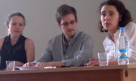 Edward Snowden, center, who is a fubitive from the United States for leaking intelligence-gathering information is shown meeting with activists at an airport in Moscow, Russia, in July 2013. (ITAR-TASS/Zuma/MCT)