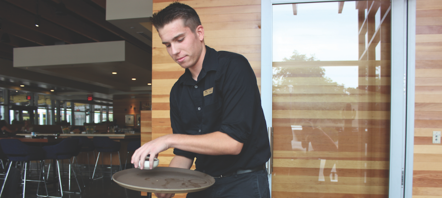 Snodgrass serving salsa at Cantina Laredo.