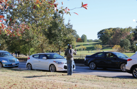 A homeless man asks for money near Skinker Blvd. in Forest Park (photo by Nick D’Agrosa).