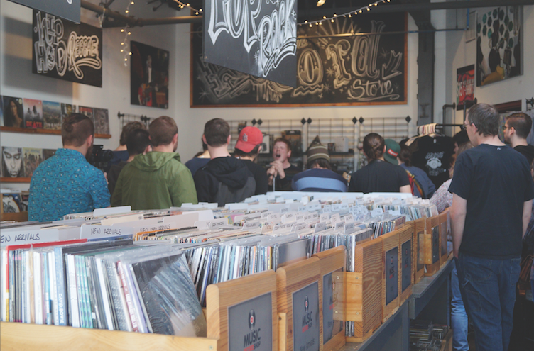 A band inhabits the local record store. (Sophie Allen)