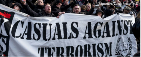 Demonstrators gather at a Brussels Attacks memorial site.