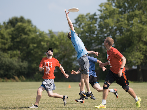 A Polar Vortex player, in blue, jumps to catch the frisbee during a game against FoG at Inwood Soccer Complex in Joliet, Ill., on June 25, 2016. (Brandon Chew/Chicago Tribune/TNS)
