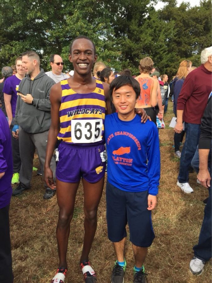 Andrew Wang stands with his first round draft pick, Blue Springs junior Victor Mugeche