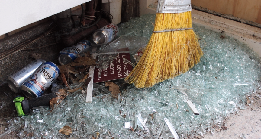 Broken glass, beer cans and other debris inside Maryland School. Photo by Katherine Sleckman.